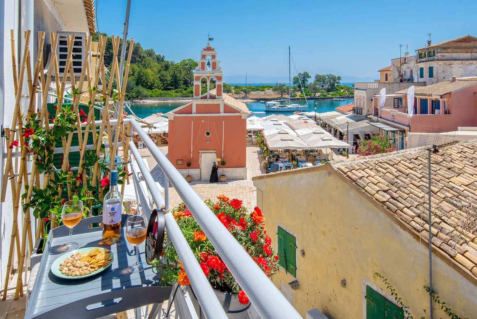 Greek island harbor with white houses and boats