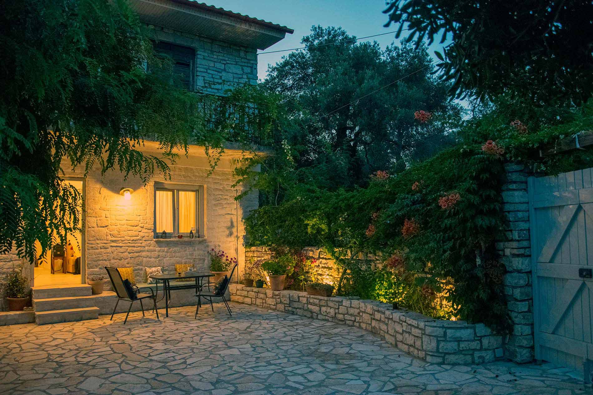 Traditional stone house surrounded by olive trees